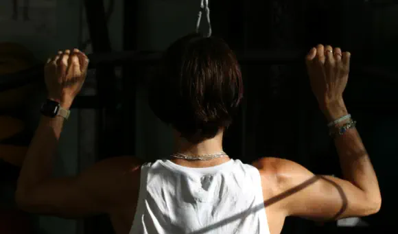 Lauren training on the cable machine in the studio